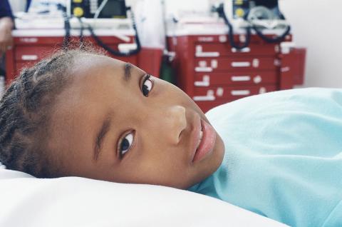 Girl in hospital bed
